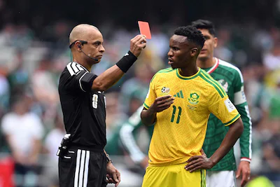 topshot-brazilian-referee-wilton-sampaio-shows-a-red-card-to-south-africa-s-midfielder-11-themba-zwa.webp
