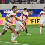 turkey-s-defender-22-kaan-ayhan-r-celebrates-after-scoring-his-teams-third-goal-during-the-2026-worl.webp