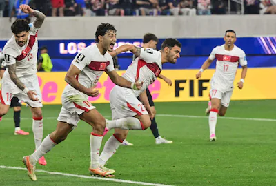 turkey-s-defender-22-kaan-ayhan-r-celebrates-after-scoring-his-teams-third-goal-during-the-2026-worl.webp