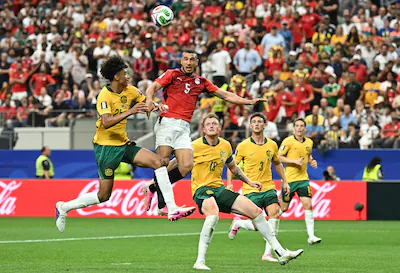 egypt-s-defender-05-ramy-rabia-c-and-australia-s-defender-25-lucas-herrington-l-jump-for-the-ball-du.webp