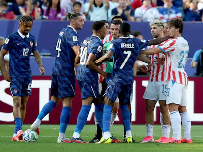 epa13087743-referee-ilgiz-tantashev-c-tries-to-seperate-players-of-france-and-paraguay-during-the-fi.webp