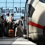 passengers-board-an-ice-intercity-express-train-of-german-rail-operator-deutsche-bahn-at-frankfurt-c.webp