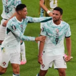 portugal-s-goncalo-ramos-9-is-congratulated-by-cristiano-ronaldo-after-scoring-a-a-goal-during-the-w.webp