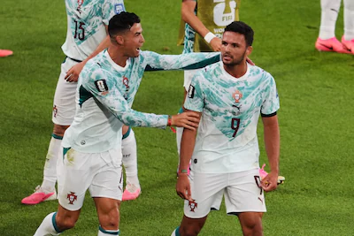 portugal-s-goncalo-ramos-9-is-congratulated-by-cristiano-ronaldo-after-scoring-a-a-goal-during-the-w.webp