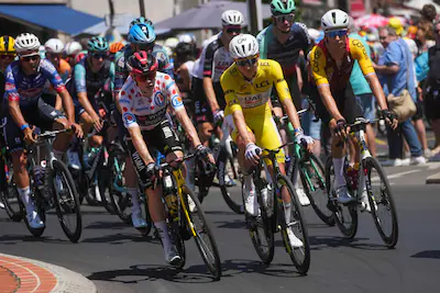 slovenia-s-tadej-pogacar-center-wearing-the-overall-leader-s-yellow-jersey-rides-in-the-pack-during.webp