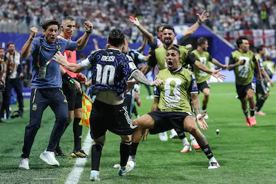 topshot-argentina-s-forward-10-lionel-messi-celebrates-with-teammate-defender-25-facundo-medina-his.webp