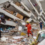 volunteers-and-a-mexican-rescuer-help-to-find-survivors-in-a-collapsed-building-in-caraballeda-la-gu.webp